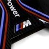 Close up shot of the M logo on the OEM BMW M Performance carbon engine cover - 11148058667