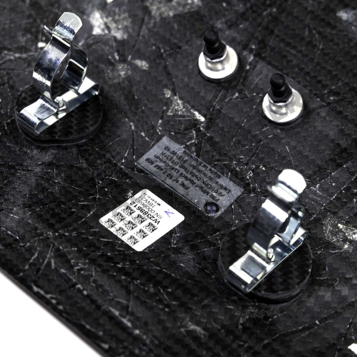 Close up of center OEM BMW M carbon engine cover extension set - 11122455570