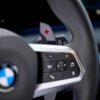 Close up shot of the OEM BMW M Extended gloss black paddle shifters - 61315A3B6A9