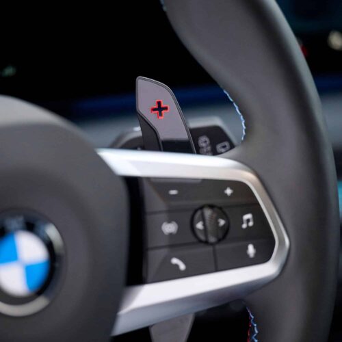 Close up shot of the OEM BMW M Extended gloss black paddle shifters - 61315A3B6A9