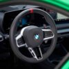 Shot of the steering wheel with the OEM BMW M Extended gloss black paddle shifters - 61315A3B6A9