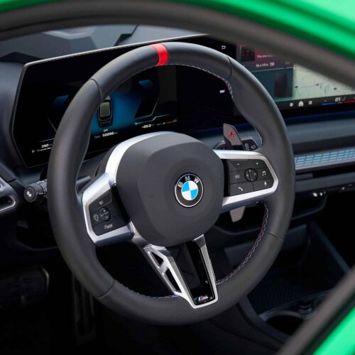 Shot of the steering wheel with the OEM BMW M Extended gloss black paddle shifters - 61315A3B6A9