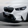 OEM BMW M Performance Front Carbon fiber splitter set 51115A7D671, 51115A7D672 on a BMW G90 M5