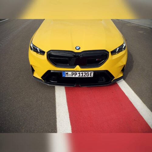 OEM BMW M Performance Front Carbon fiber splitter set 51115A7D671, 51115A7D672 on a BMW yellow G90 M5