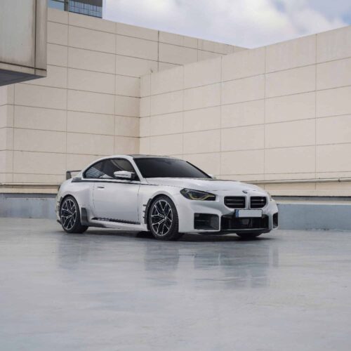 Side, far shot of INDIV Carbon fiber front grilles for BMW G87 M2