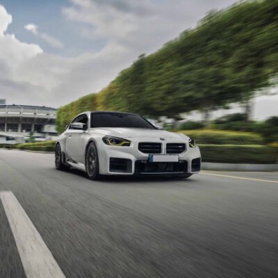 Side rolling shot of INDIV Carbon fiber front grilles for BMW G87 M2
