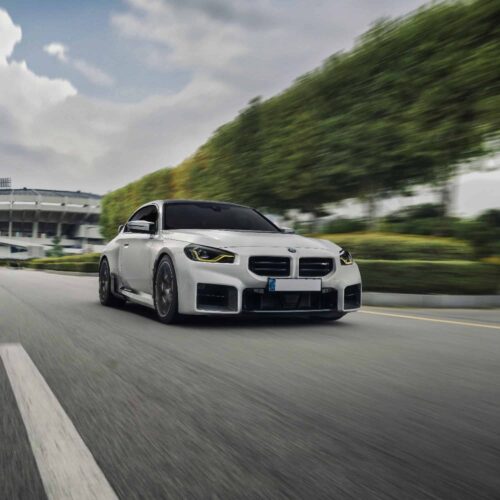 Side rolling shot of INDIV Carbon fiber front grilles for BMW G87 M2