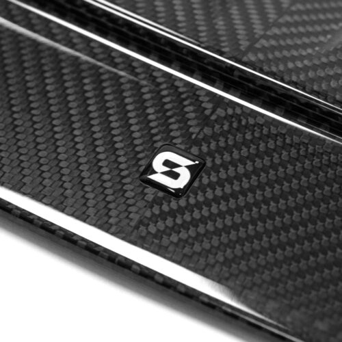 Close up showing the logo on Sterckenn Carbon fiber front lip, spoiler for G87 M2