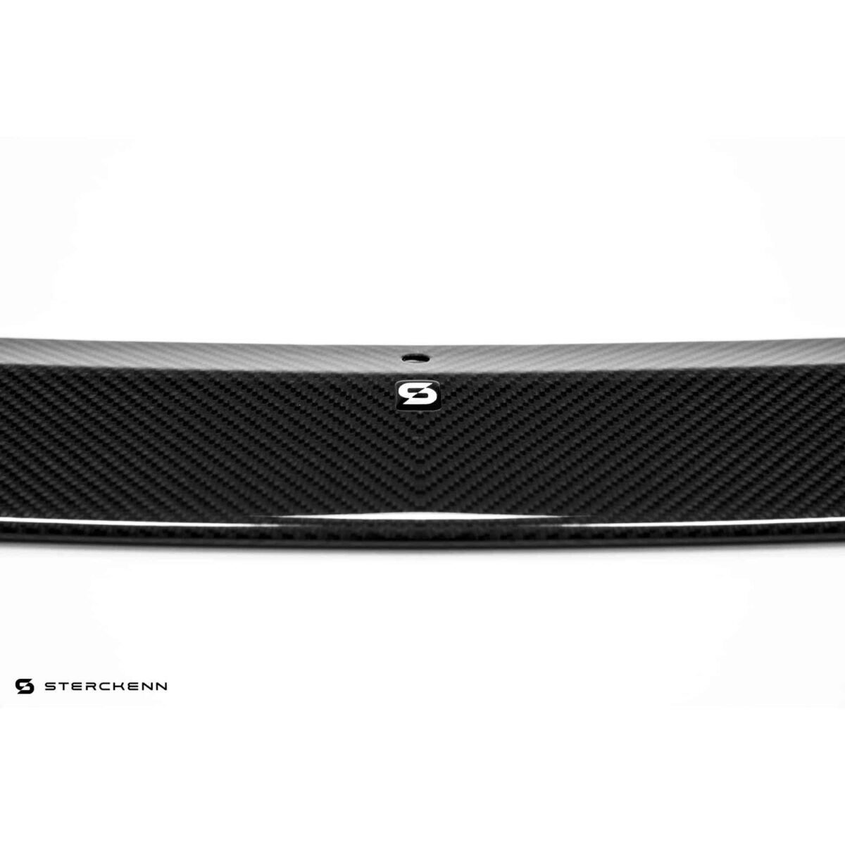 Close up of the logo on Sterckenn Carbon fiber front lip, spoiler for F90 M5 LCI