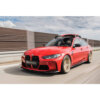 Rolling shot of a red G80 M3 fitted with Sterckenn Carbon fiber front lip, spoiler for G8X M3