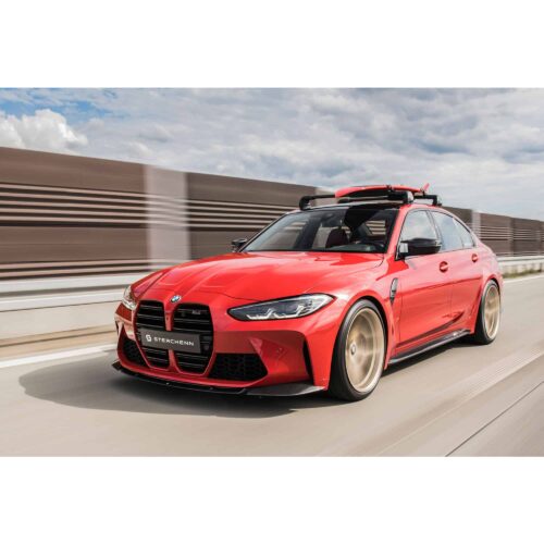 Rolling shot of a red G80 M3 fitted with Sterckenn Carbon fiber front lip, spoiler for G8X M3