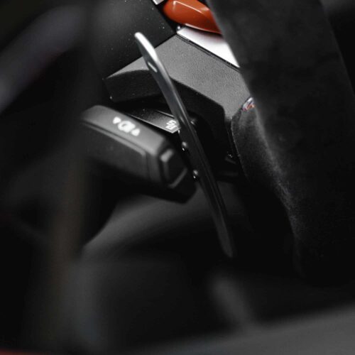 Aluminium paddle shifters for F:G Series and Supra - Silver mounted on a wheel from the side