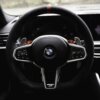 Aluminium paddle shifters for F/G Series and Supra - Silver installed in a BMW G87 M2 with a flat bottom steering wheel