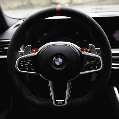 Aluminium paddle shifters for F/G Series and Supra - Silver installed in a BMW G87 M2 with a flat bottom steering wheel