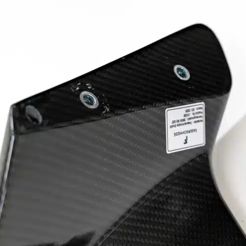 Close up photo of the feet of Competition Carbon fiber Rear Wing for BMW G87 M2