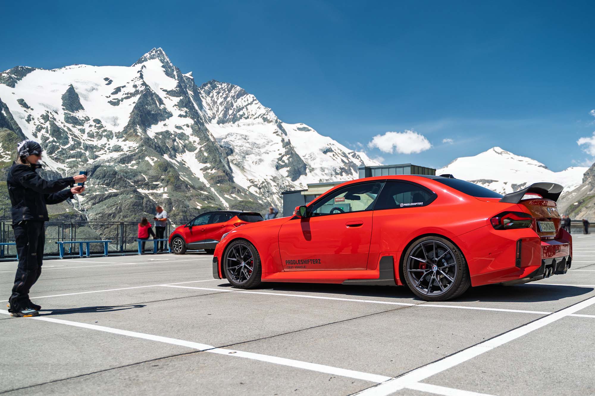 PaddleShifterz Cover Image with a toronto red BMW G87 M2 in the mountains with M performance parts