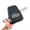 OEM BMW 50 Year M Edition Headrest - 52107858470 in a mans hand