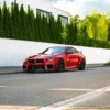 Red G87 M2 with no license plate on